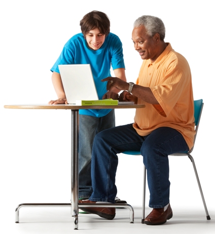 man and boy at computer