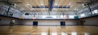 Large gymnasium with basketball courts at the YMCA at the Heights
