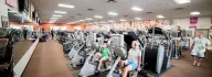 Wellness center at the Coffman YMCA with bikes and treadmills filling the space