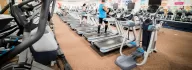 Treadmills in two rows line the wellness center at the Coffman YMCA