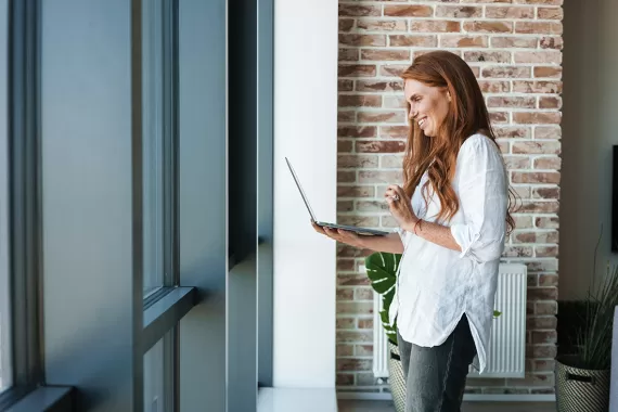 A woman on a video call with a wellness coach
