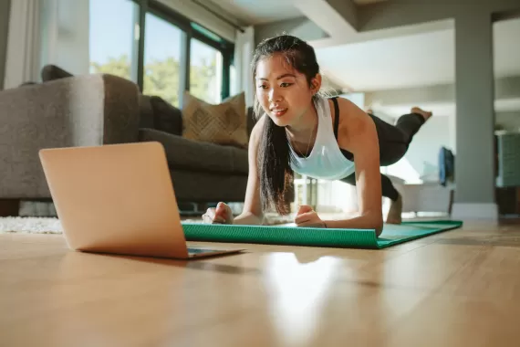 Woman working out in her home