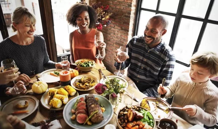 A group of people sharing Thanksgiving Dinner