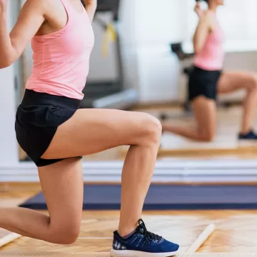 A woman in the gym doing squats