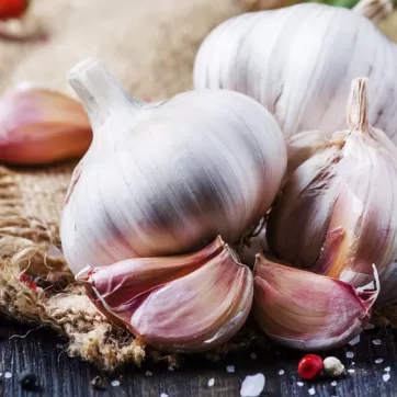 Garlic cloves sitting on a counter in a kitchen