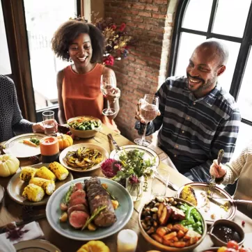A group of people sharing Thanksgiving Dinner