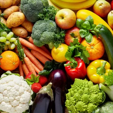 A multitude of vegetables sitting in a pile.