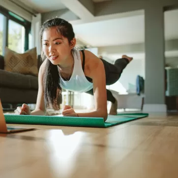 Woman working out in her home