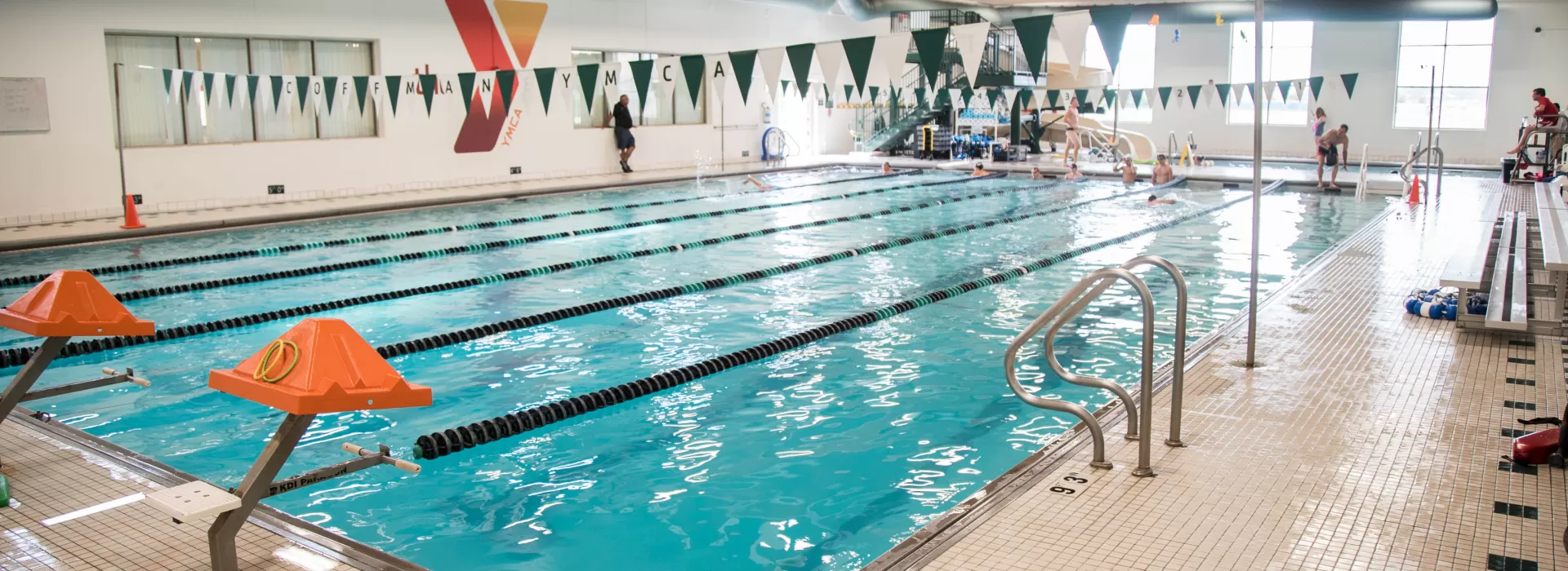 6-lane pool at the Coffman YMCA with additional water slide in the back