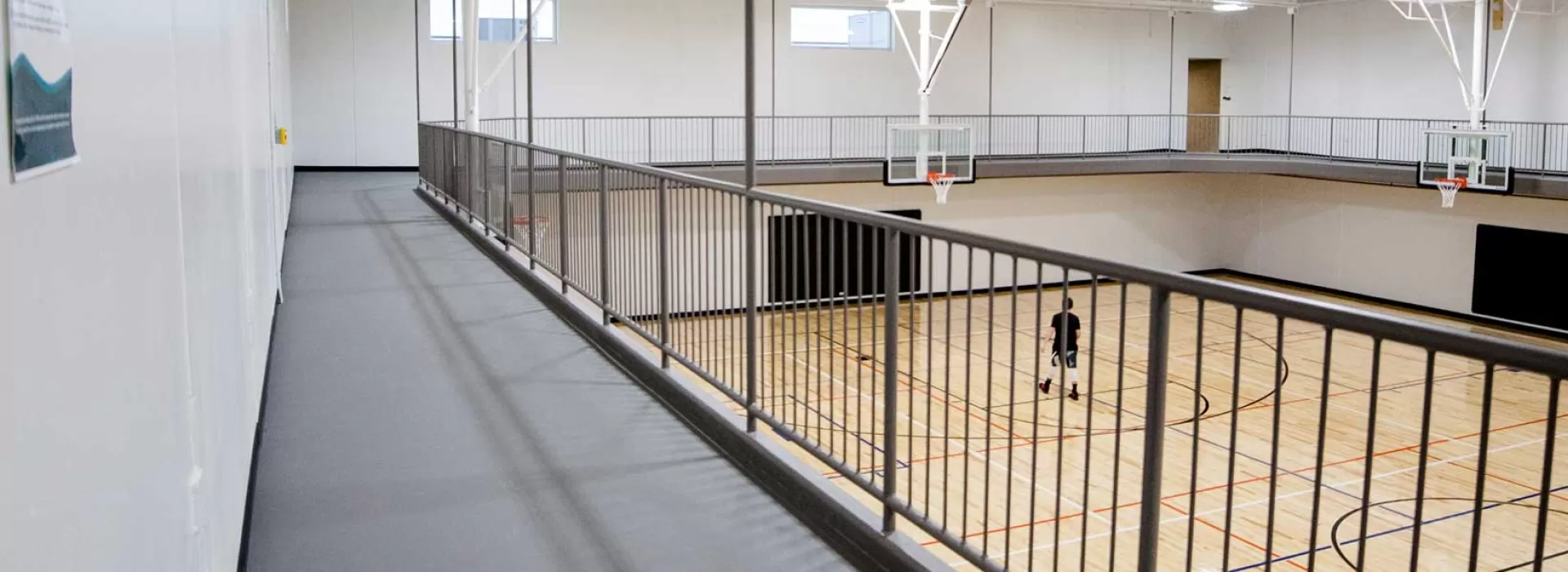 Suspended walking track at the Xenia YMCA with a gymnasium underneath it