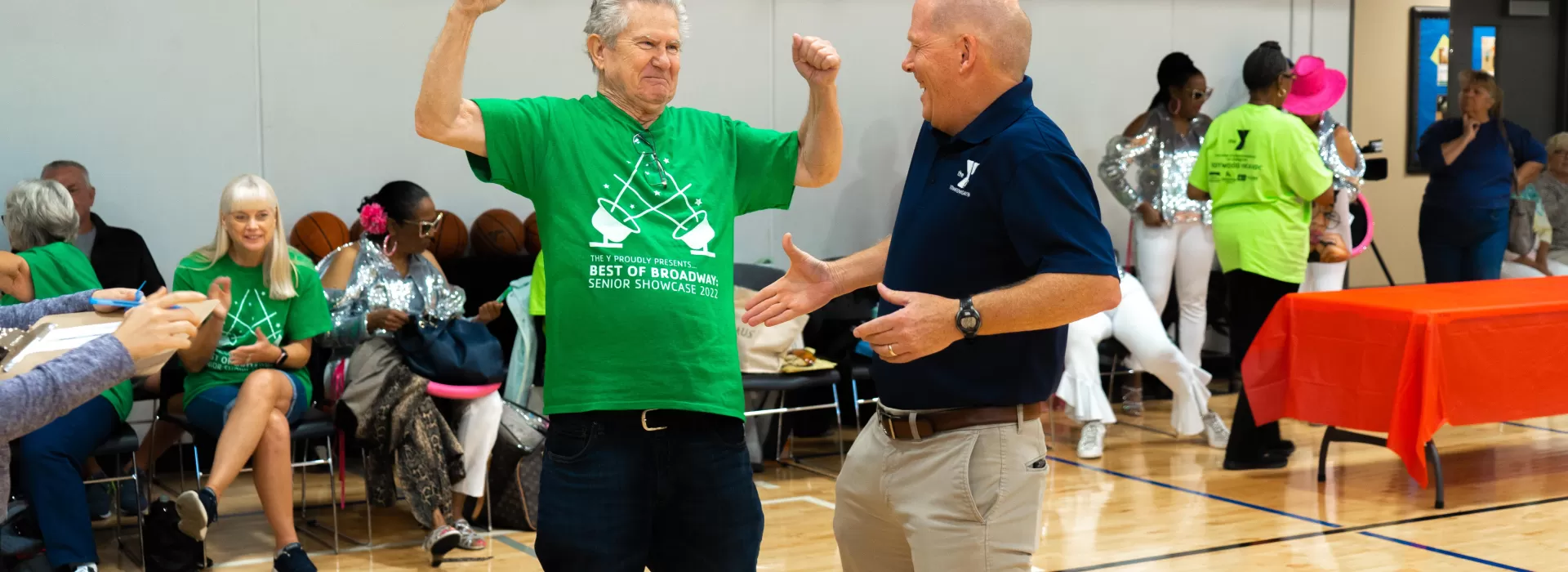Seniors shaking hands with Y Director