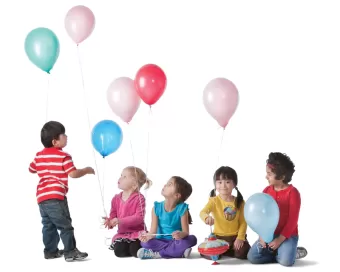 A group of kids holding balloons